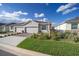 Two-car garage and landscaped front yard with brick pavers at 5395 Nw 46Th Ln, Ocala, FL 34482