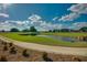 Scenic golf course with a pond and lush green landscape at 5395 Nw 46Th Ln, Ocala, FL 34482