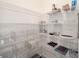 Well-organized pantry with wire shelving and clear storage bins at 5395 Nw 46Th Ln, Ocala, FL 34482