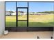 Relaxing screened patio overlooking a grassy backyard at 5395 Nw 46Th Ln, Ocala, FL 34482