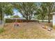 Large backyard with a swingset and play area at 55 Almond Rd, Ocala, FL 34472