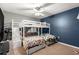 Bedroom with bunk beds, ceiling fan and blue accent wall at 55 Almond Rd, Ocala, FL 34472