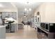 Kitchen with gray cabinets, microwave, and view into the living room at 55 Almond Rd, Ocala, FL 34472