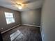 Spacious bedroom with gray walls, gray carpet, and ceiling fan at 6450 Nw 57Th Ave, Ocala, FL 34482