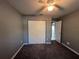 Bedroom with double door closet and carpet at 6450 Nw 57Th Ave, Ocala, FL 34482