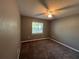 Bright bedroom with ceiling fan and carpet at 6450 Nw 57Th Ave, Ocala, FL 34482