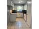 Kitchen with white cabinets and dark countertop at 6450 Nw 57Th Ave, Ocala, FL 34482