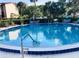 Community pool with ample deck space at 674 Midway Dr # A, Ocala, FL 34472