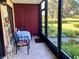 Cozy screened patio with seating area and view of the garden at 674 Midway Dr # A, Ocala, FL 34472