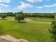 Golf course view with green fairways and sand traps at 7549 Nw 33Rd Pl, Ocala, FL 34482