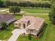 Luxury home with tile roof and paved driveway at 7549 Nw 33Rd Pl, Ocala, FL 34482