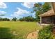 Expansive backyard with golf course view and stone wall at 7549 Nw 33Rd Pl, Ocala, FL 34482