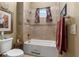 Bathroom with a shower/tub combo and neutral tile at 7549 Nw 33Rd Pl, Ocala, FL 34482