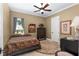 Comfortable bedroom with a queen-size bed and ceiling fan at 7549 Nw 33Rd Pl, Ocala, FL 34482