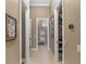 Long hallway with access to bathroom and closets at 7549 Nw 33Rd Pl, Ocala, FL 34482