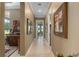 Long hallway with art and access to other rooms at 7549 Nw 33Rd Pl, Ocala, FL 34482