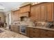 Spacious kitchen featuring stainless steel appliances and rich wood cabinets at 7549 Nw 33Rd Pl, Ocala, FL 34482