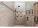 Luxurious shower with multiple shower heads and tile surround at 7549 Nw 33Rd Pl, Ocala, FL 34482