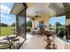 Sunroom with table and chairs, offering scenic views of the golf course at 7549 Nw 33Rd Pl, Ocala, FL 34482