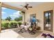 Covered patio with dining area and view of the golf course at 7549 Nw 33Rd Pl, Ocala, FL 34482