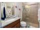 Clean bathroom with granite vanity, shower, and nautical decor at 7617 Sw 96Th Avenue Rd, Ocala, FL 34481