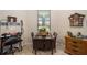 Small breakfast nook featuring a wooden table and wicker chairs at 7617 Sw 96Th Avenue Rd, Ocala, FL 34481