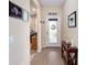 Bright and airy entryway with wood-look floors and a console table at 7617 Sw 96Th Avenue Rd, Ocala, FL 34481