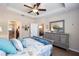 Main bedroom with gray dresser and access to the bathroom and living room at 7617 Sw 96Th Avenue Rd, Ocala, FL 34481