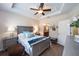 Main bedroom with gray furniture and a ceiling fan at 7617 Sw 96Th Avenue Rd, Ocala, FL 34481