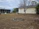 Large backyard with detached garage and shed at 8009 County Road 109D, Lady Lake, FL 32159