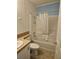 Clean bathroom with shower/tub combo and tile flooring at 8009 County Road 109D, Lady Lake, FL 32159