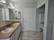 Bathroom with double vanity and tiled floor at 8009 County Road 109D, Lady Lake, FL 32159