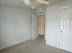 Bedroom with ceiling fan and carpet at 8009 County Road 109D, Lady Lake, FL 32159