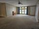 Living room with fireplace and large window at 8009 County Road 109D, Lady Lake, FL 32159