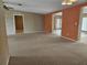 Large living room with neutral walls and carpeting at 8009 County Road 109D, Lady Lake, FL 32159