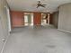 Spacious living room with carpeting and ceiling fan at 8009 County Road 109D, Lady Lake, FL 32159