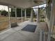 Spacious screened porch overlooking backyard at 8009 County Road 109D, Lady Lake, FL 32159