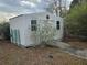 Ample storage space with a shed featuring a ramp for easy access at 8009 County Road 109D, Lady Lake, FL 32159