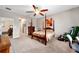 Bright bedroom with ensuite access and ceiling fan at 8230 Sw 78Th Cir, Ocala, FL 34476