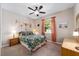 Cozy bedroom with ceiling fan and ensuite bathroom at 8230 Sw 78Th Cir, Ocala, FL 34476