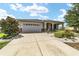 One-story home with landscaped yard and covered porch at 8230 Sw 78Th Cir, Ocala, FL 34476