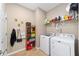 Laundry room with washer, dryer, and shelving at 8230 Sw 78Th Cir, Ocala, FL 34476