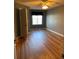 Bright bedroom featuring wood-look floors and a ceiling fan at 8340 Sw 108Th Place Rd, Ocala, FL 34481