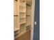 Large walk-in closet with built-in shelving and hanging rods at 8340 Sw 108Th Place Rd, Ocala, FL 34481