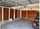 Garage with built-in cabinets and golf cart at 8340 Sw 108Th Place Rd, Ocala, FL 34481