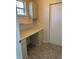 Laundry area with built-in cabinets and countertop workspace at 8340 Sw 108Th Place Rd, Ocala, FL 34481