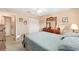 Bright bedroom with double bed, dresser, and access to bathroom at 8961 Sw 94Th Ln # C, Ocala, FL 34481