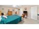 Spacious bedroom with wood furniture, a ceiling fan, and a large closet at 8961 Sw 94Th Ln # C, Ocala, FL 34481