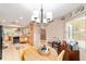 Kitchen dining area showcasing a round table, chandelier, and built-in cabinets at 8961 Sw 94Th Ln # C, Ocala, FL 34481