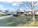 House exterior showcasing a front yard and a tree at 8961 Sw 94Th Ln # C, Ocala, FL 34481